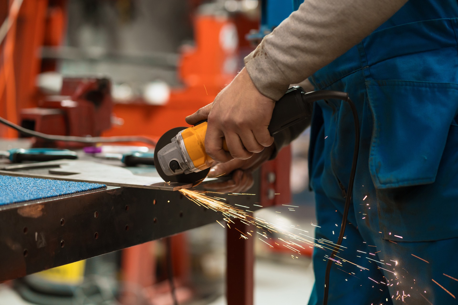 worker-working-with-circular-grinder-metal-with-sparks.jpg